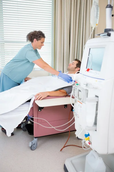 Nurse Setting up Dialysis on male patient — Stock Photo, Image