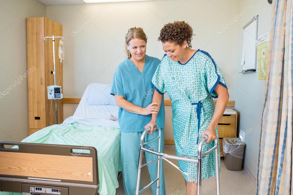 Nurse Helping Patient To Walk Using Walker In Hospital — Stock Photo