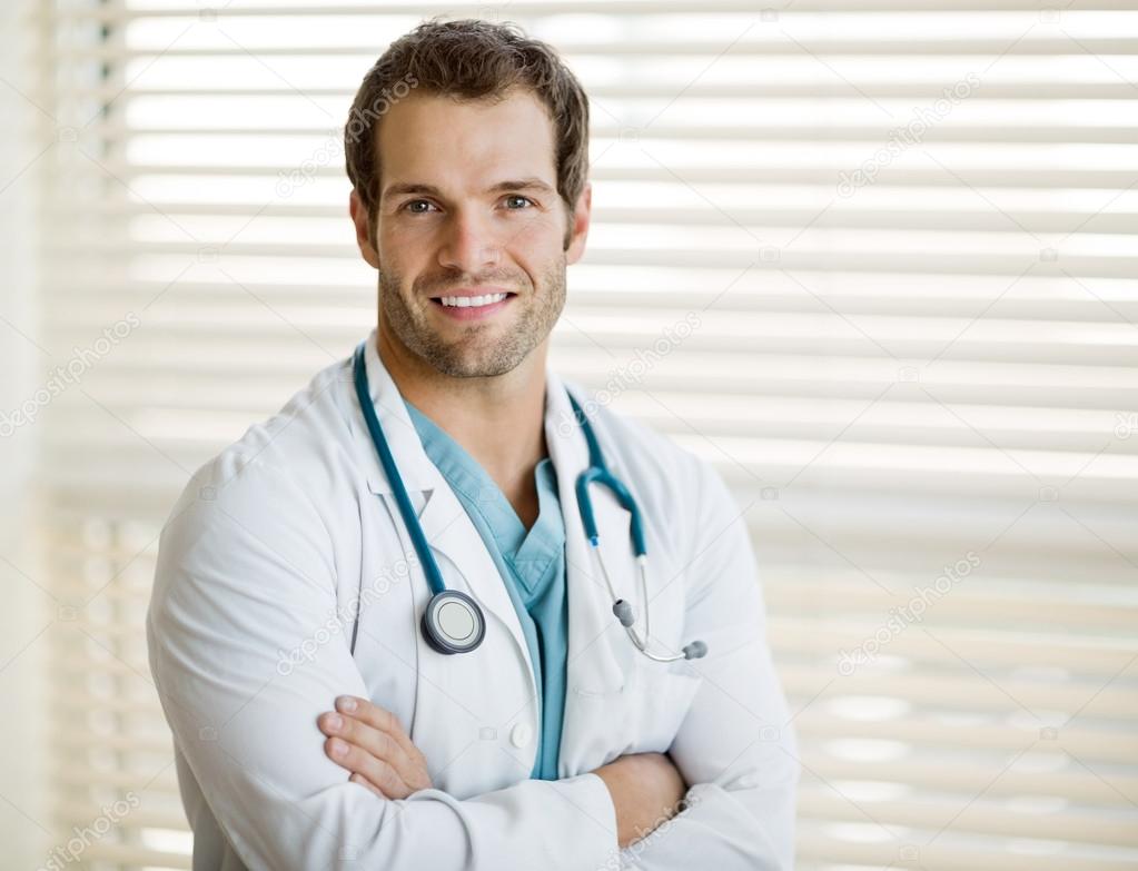 Confident Male Doctor With Arms Crossed