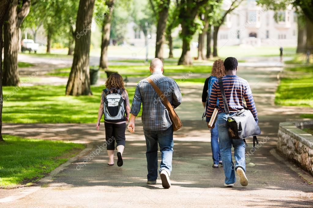 University Students Walking On Campus Road