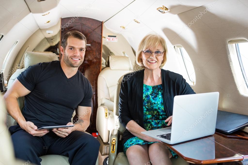 Confident Business People On Private Jet