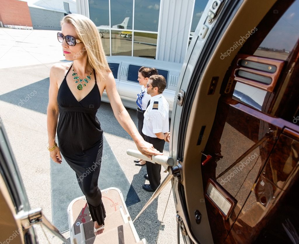 Beautiful Woman In Dress Boarding Private Jet