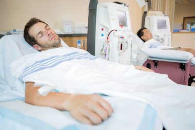 Patients Sleeping While Receiving Renal Dialysis clipart