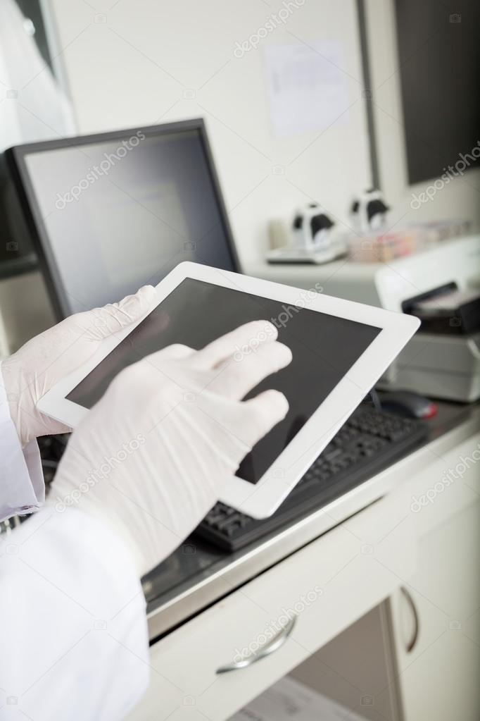 Researcher Using Tablet Computer In Lab