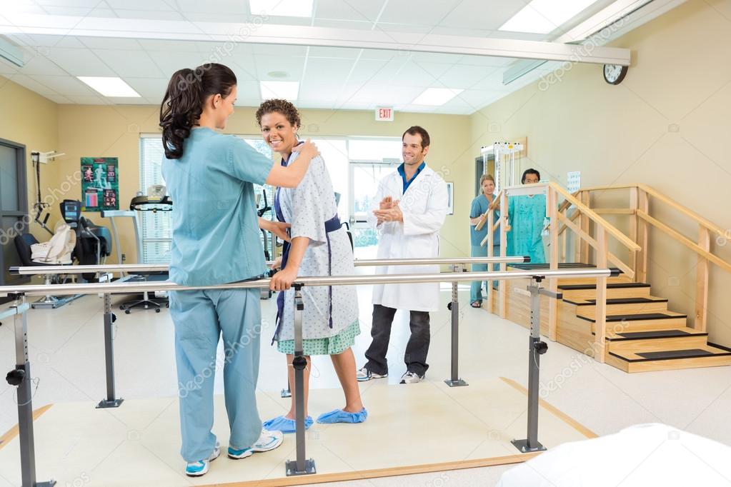 Patient Being Assisted By Physical Therapist