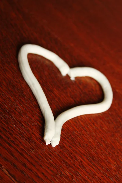 Heart shape from cream — Stock Photo, Image