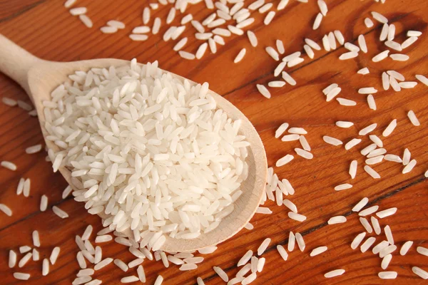 Rice in spoon — Stock Photo, Image