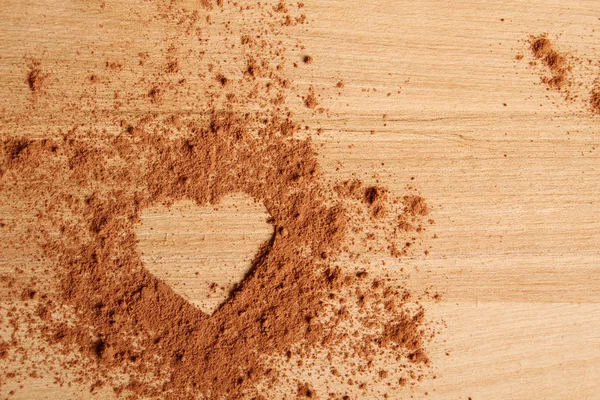 Heart shape made ??of cocoa — Stock Photo, Image