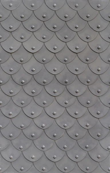 Metal armor fish scale with rivets — Stock Photo, Image