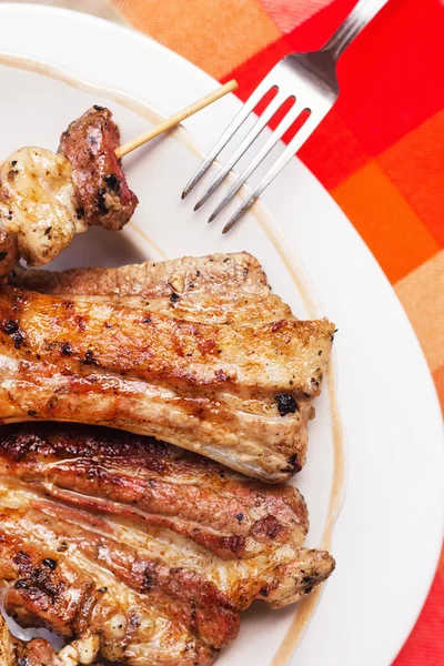 Grilled pork ribs on a plate — Stock Photo, Image