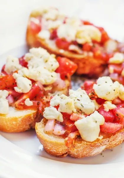 Bruschetta ( Italian Toasted Garlic Bread ) with tomato & cheese, shallow dof — Stock Photo, Image