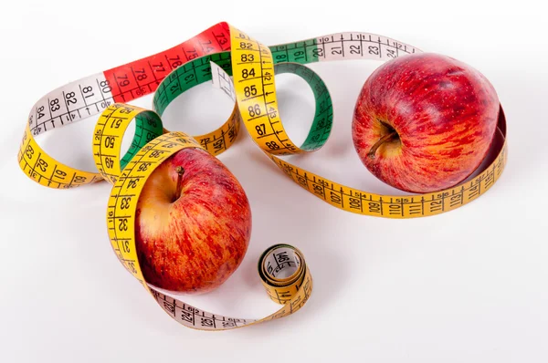 Tape measure and red apple — Stock Photo, Image