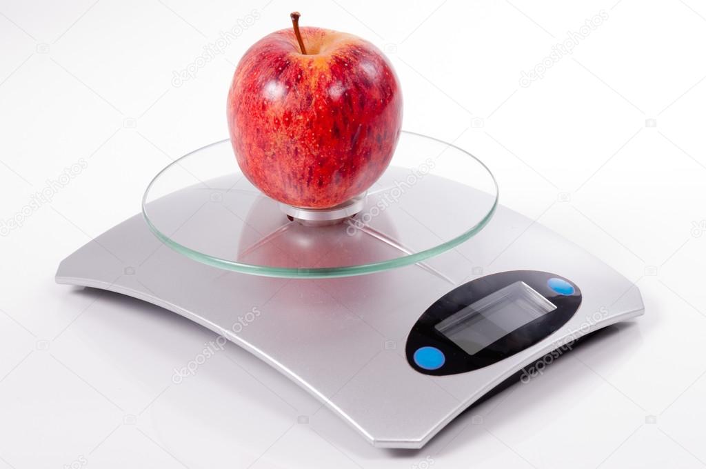 red apple on kitchen scale
