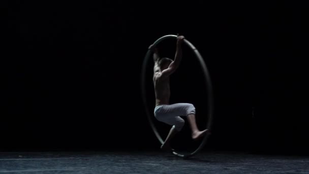 Muscular Circus Artist Perform Cyr Wheel Black Background Stage Slow — стоковое видео