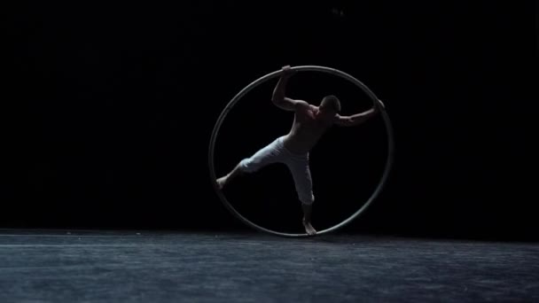 Muscular Circus Artist Perform Cyr Wheel Black Background Concept Willpower — Videoclip de stoc