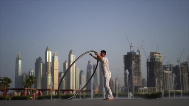 Cyr Wheel Artist Wearing White Arabic Clothing Cloth Dubai Cityscape — Vídeos de Stock
