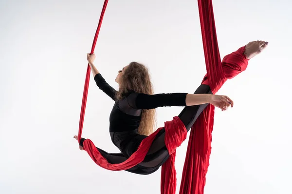 Flexible Female Circus Artist Perform Red Aerial Silk White Background — Foto Stock