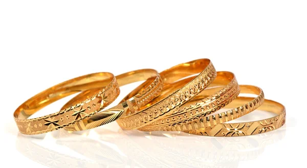 Goldene Armbänder — Stockfoto