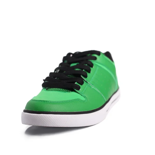 Зеленые кроссовки — стоковое фото