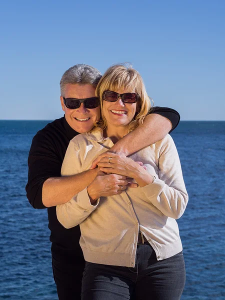 Romantic mature attractive couple at the seaside — Stock Photo, Image