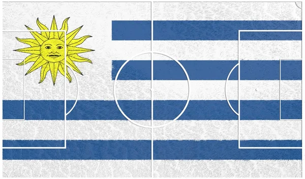 Uruguay flag on football field — Stock Photo, Image