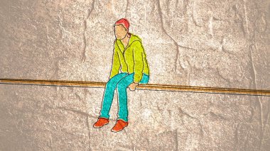 Işının üzerinde oturan ve düşünen bir gencin silueti