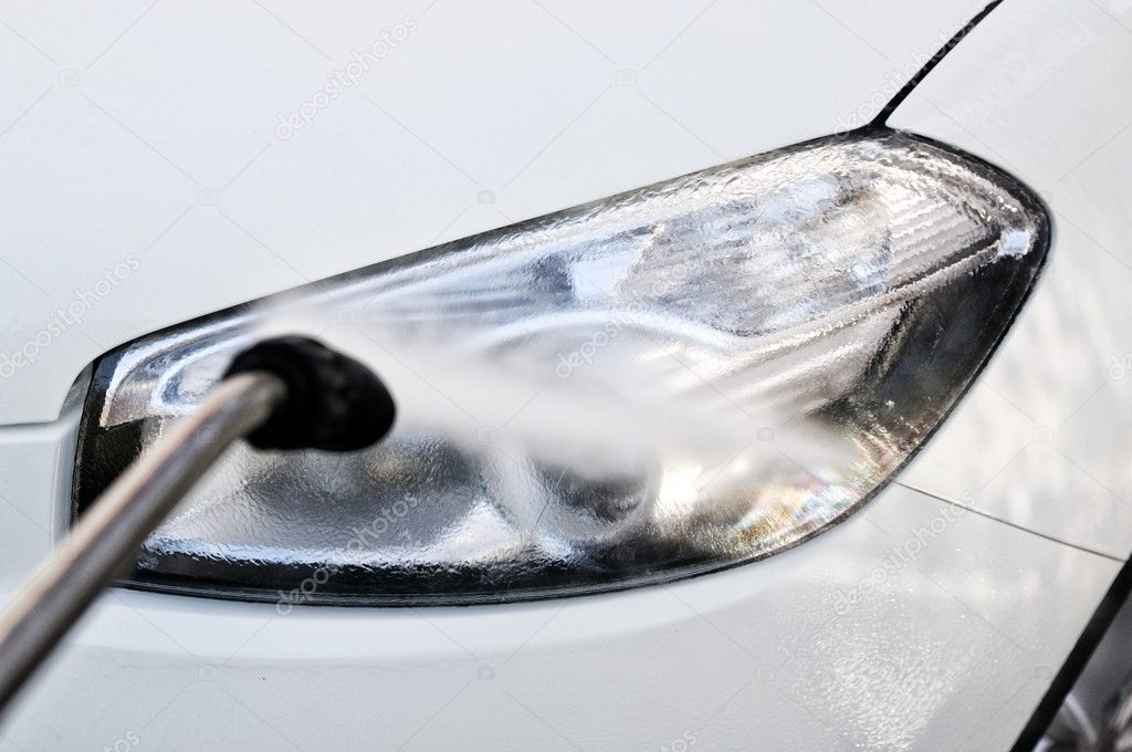 Washing a car lamp at carwash