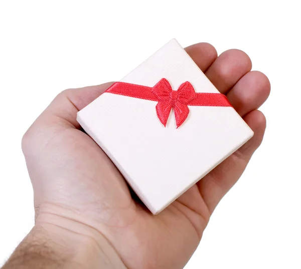 Gift box in a male hand Royalty Free Stock Photos