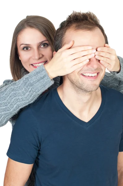 Young woman covering her man's eyes to surprise him — Stock Photo, Image