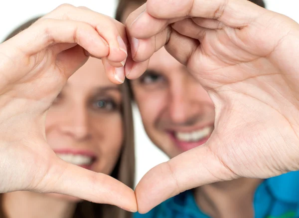 Close-up of Couple making heart gesture of love Stock Image