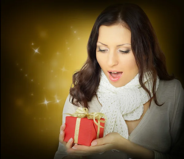 Surprise woman with Christmas gift — Stock Photo, Image