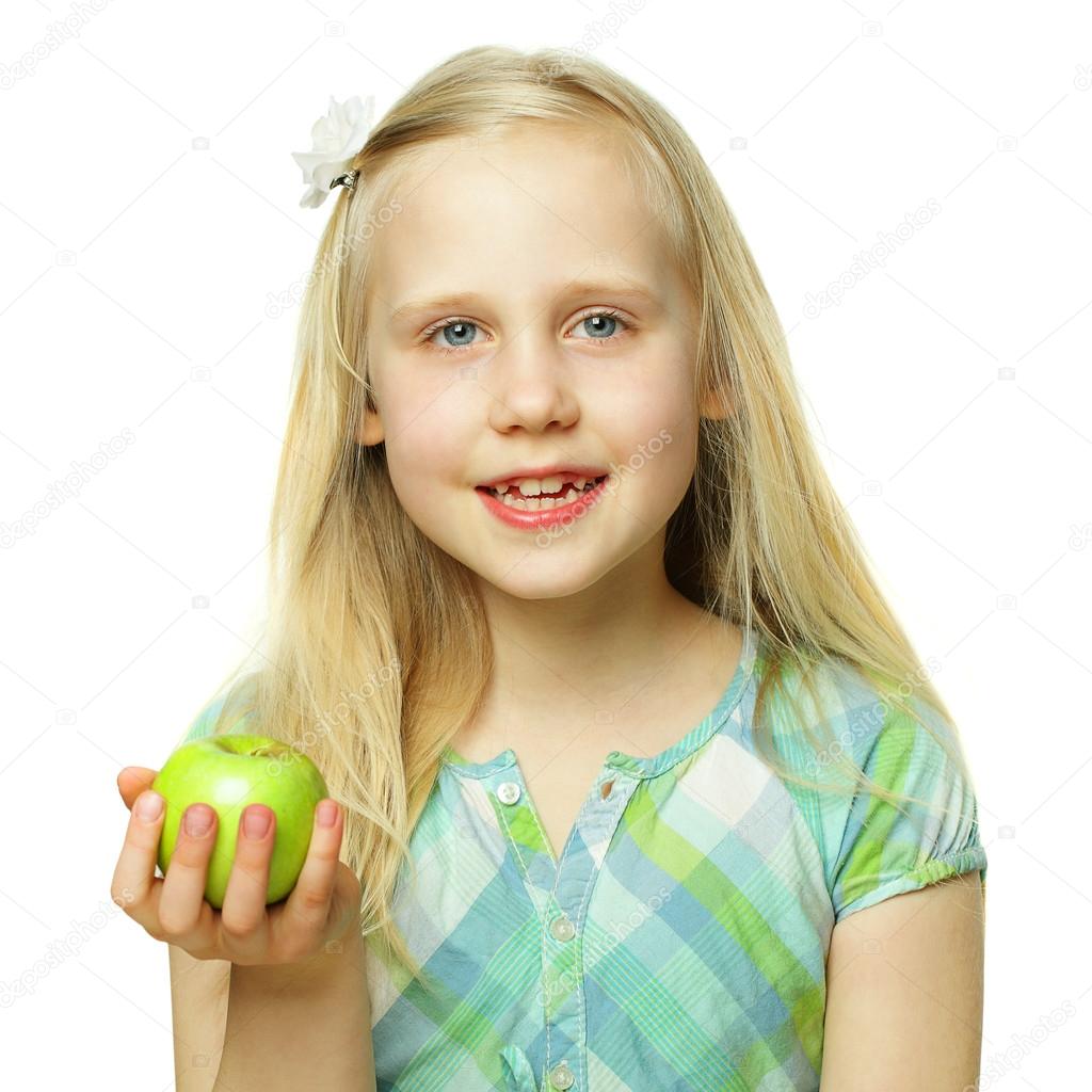 Healthy eating concept, smiling child girl holding green apple,