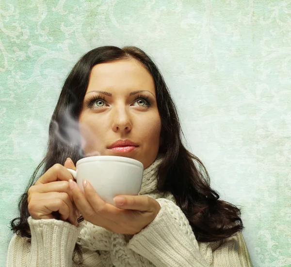 Woman in warm scarf with hot drink — Stock Photo, Image