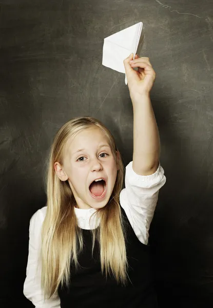 Child girl with paper plane - fun! — Stock Photo, Image