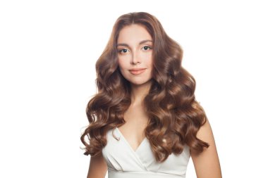 Nice fashion model with long healthy shiny wavy hairstyle isolated on white. Beautiful woman with curly hair