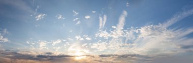 Panorama of a blue sky with white clouds, dawn backround