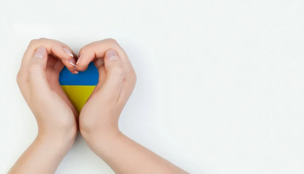 Female Hand Holding Heart Ukrainian Flag White Background Love Ukraine — Zdjęcie stockowe
