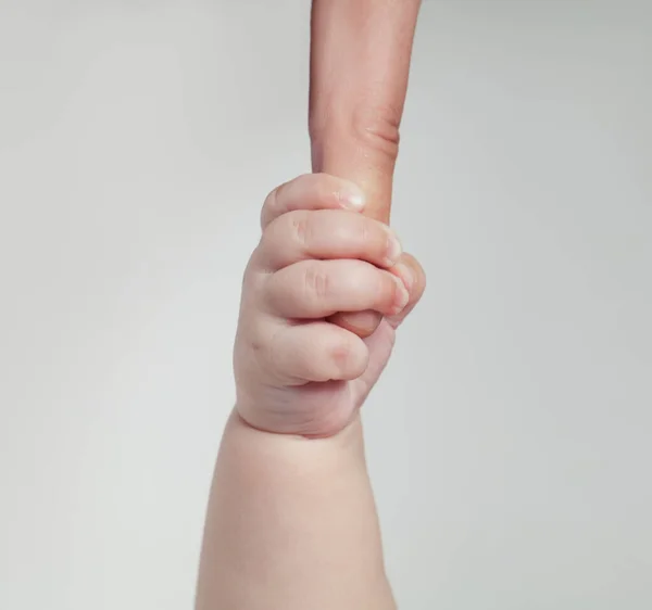 Newborn Baby Touching His Mother Hand Gentle White Background —  Fotos de Stock