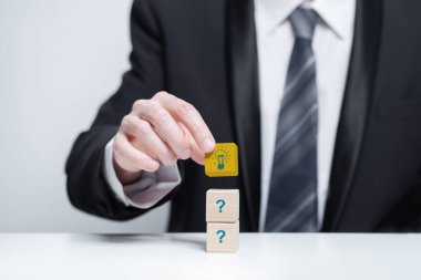 Businessman hand showing creative business strategy with light bulb, Idea and brainstorming concept