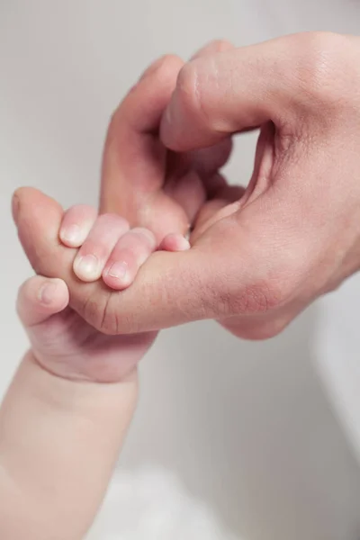 Adult Hand Holding Her Newborn Baby Hand White Background Childhood — Stock Photo, Image