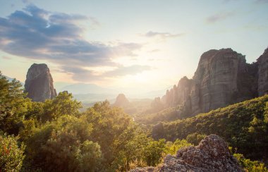 Beautiful summer nature, rocks, sun and sky clouds in Meteora valley, Greece