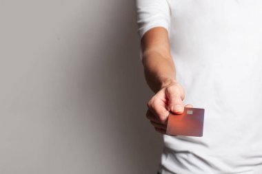 Credit card in female hand on white banner background