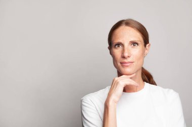 Elegant mature woman smiling, beautiful face close up. Facial treatment and skin care concept