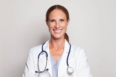 Cheerful woman doctor with happy positive smile portrait