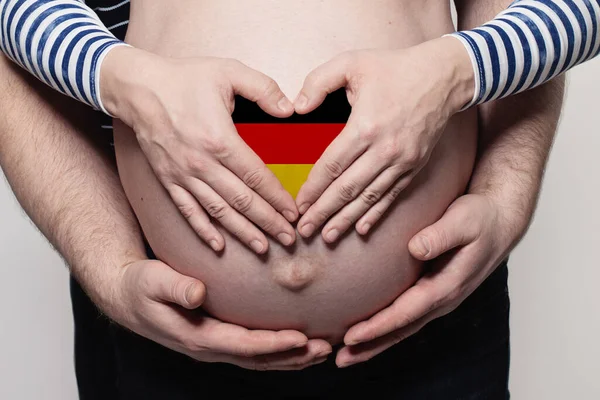 German Family Concept Man Embracing Pregnant Woman Belly Heart Flag —  Fotos de Stock