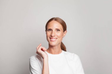 Happy optimistic woman with cute friendly smile portrait