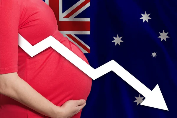 Australian pregnant woman on Australian flag background. Falling fertility rate in Australia
