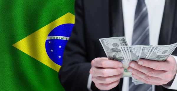 Hands Holding Dollar Money Flag Brazil — Stok fotoğraf