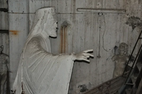 Statue of patriarch and broken sculptures — Stock Photo, Image