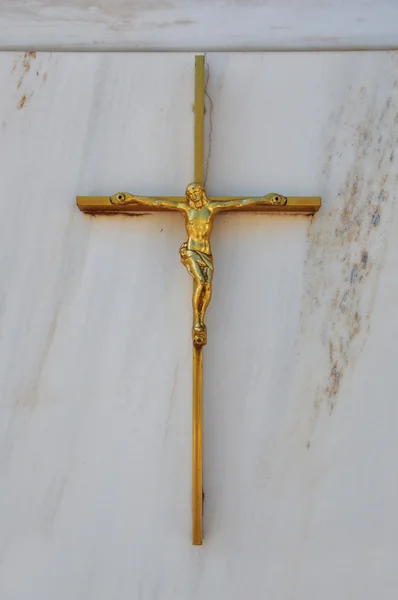 Golden crucifix on marble background — Stock Photo, Image